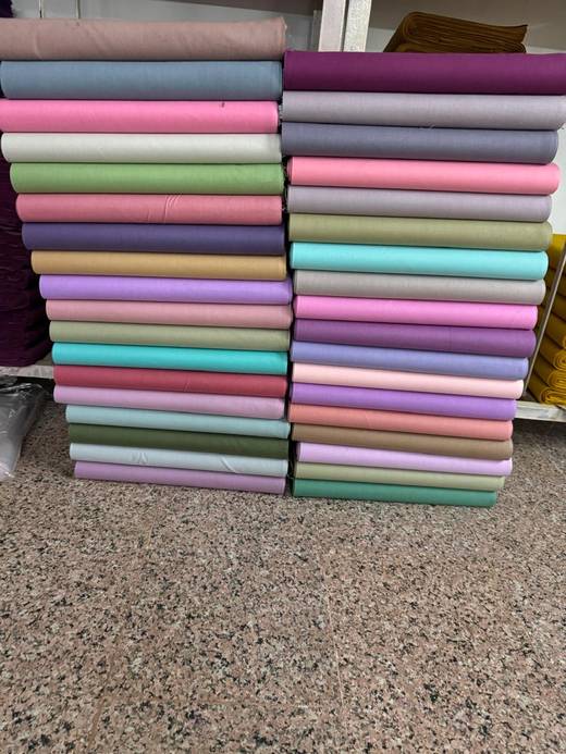 Balaji Textile Mills showroom — petticoat fabric rolls and finished fabric stock ready for wholesale